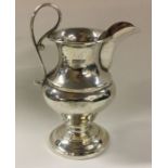 CHESTER: An Edwardian silver cream jug of shaped f