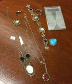 A silver brooch together with pendants etc. Est. £