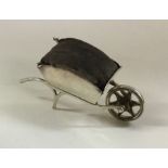 A rare silver pin cushion in the form of a wheelba