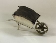 A rare silver pin cushion in the form of a wheelba