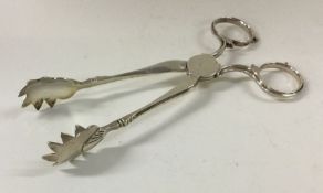 A pair of 18th Century silver sugar nips marked wi