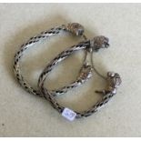 A pair of heavy Continental silver bracelets. Appr