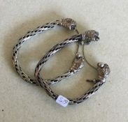 A pair of heavy Continental silver bracelets. Appr