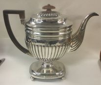 A large Georgian silver half fluted kettle on stan