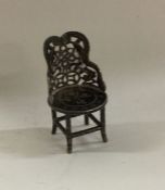A Chinese pierced miniature silver chair. Est. £30