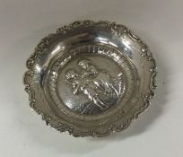 A heavy large circular silver sweet dish in relief