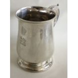 A good heavy George III baluster shaped silver mug