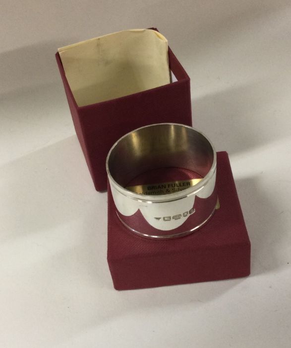 BRIAN FULLER: A cased silver napkin ring dated 200