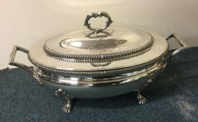 A massive Georgian silver soup tureen and cover on