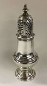 A George III silver sugar caster. By Samuel Wood.