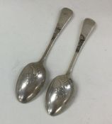 A matched pair of silver picture back spoons. Shef