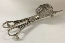 A fine pair of George III silver candle snuffers.