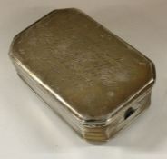 A good Edwardian silver box with scroll decoration