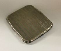 A silver and enamel engine turned cigarette case.