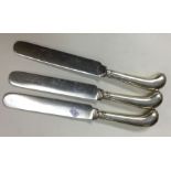 A set of three silver handled knives with steel bl