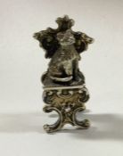 A miniature cast silver chair with a seated cat. B