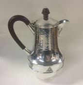 A E JONES: A large heavy silver coffee pot of text