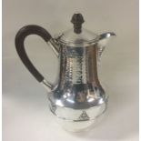 A E JONES: A large heavy silver coffee pot of text