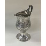 A good George III chased silver cream jug. London
