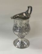 A good George III chased silver cream jug. London