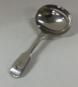 A silver plated caddy spoon. Est. £10 - £20.