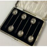 A set of six silver bean top coffee spoons with fl