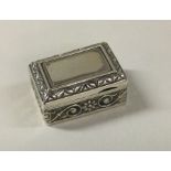 A Sterling silver chased box. Approx. 12 grams. Est. £30 - £40.