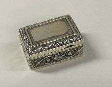A Sterling silver chased box. Approx. 12 grams. Est. £30 - £40.
