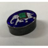 A silver and enamel elephant pill box. Approx. 10