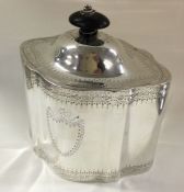A George III silver caddy with vacant cartouche. L