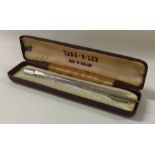A silver cased pencil. Approx. 22 grams.