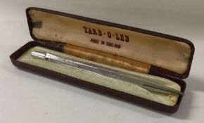 A silver cased pencil. Approx. 22 grams.