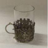 A silver chased and pierced spirit tot. Marked to
