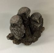 A silver model of a mother owl with owlets. Birmin