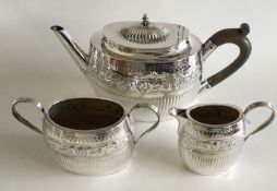 An attractive chased silver bachelor's three piece