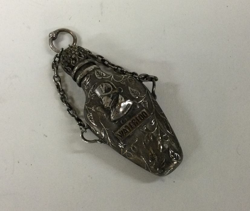 An unusual silver plated scent bottle with chain w