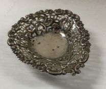 A Victorian chased and pierced silver dish