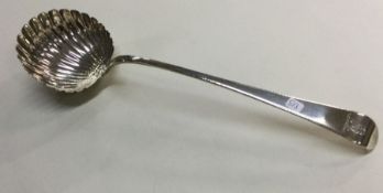 A heavy silver soup ladle with fluted bowl to cres