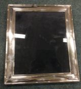 A large modern silver picture frame. Est. £40 - £6