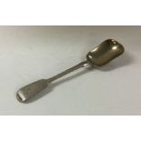 A heavy silver fiddle pattern caddy scoop. London.