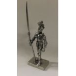 A silver figure of a knight. Approx. 51