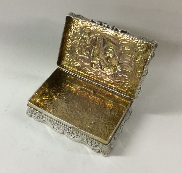 A chased silver snuff box with Victorian scene dec - Image 2 of 2