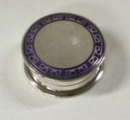 A silver and enamel box. Birmingham 1910. By James