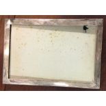 A large rectangular plain silver picture frame. Lo
