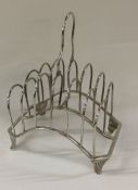 A large George III silver toast rack with folding