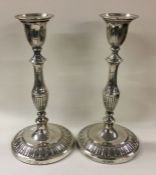 A pair of silver candlesticks. London 1916. By Gol