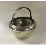 A heavy Russian silver plain swing handled basket.