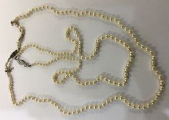 A graduated string of pearl beads together with on