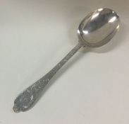 A good Georgian style lace back silver spoon. Lond