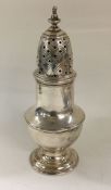 A George II silver sugar caster. By Samuel Wood. E